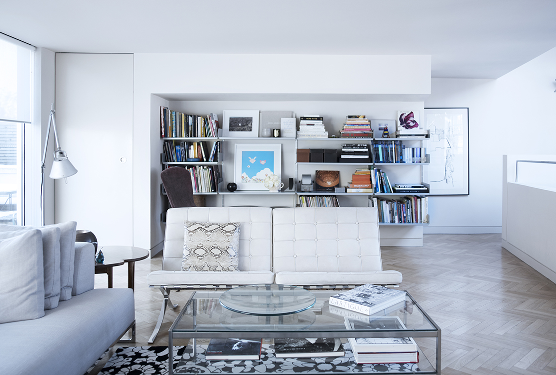 The open plan living and dining area opens onto a pretty garden terrace with full width sliding glass.