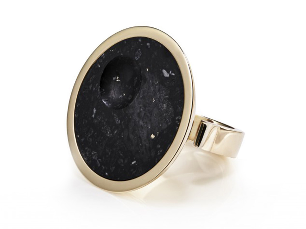 Gold malachite ring inset with meteorite.