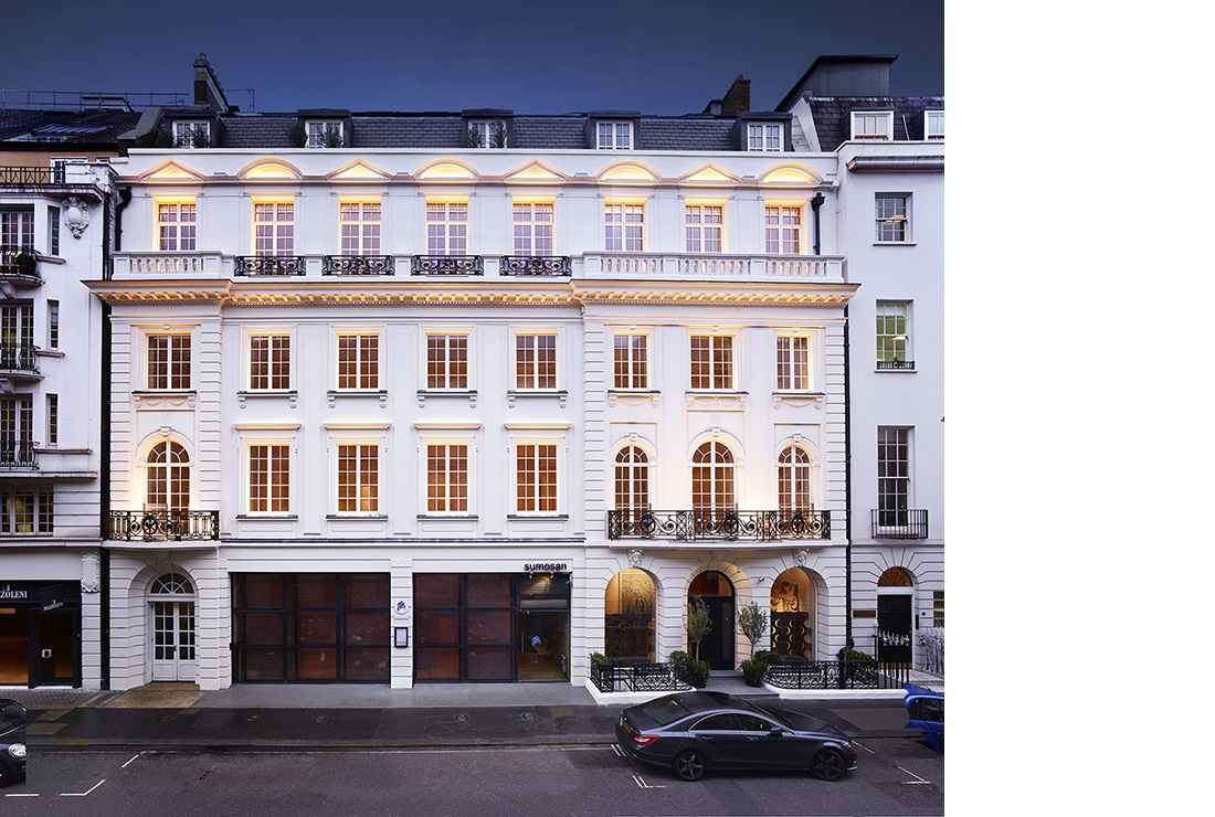 The traditional Beaux Arts building contrasts with the contemporary style of the apartments within.