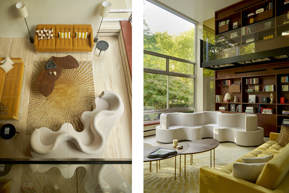 The living room with fire place and sliding walnut overpanels give the room a focus and a sense of warmth