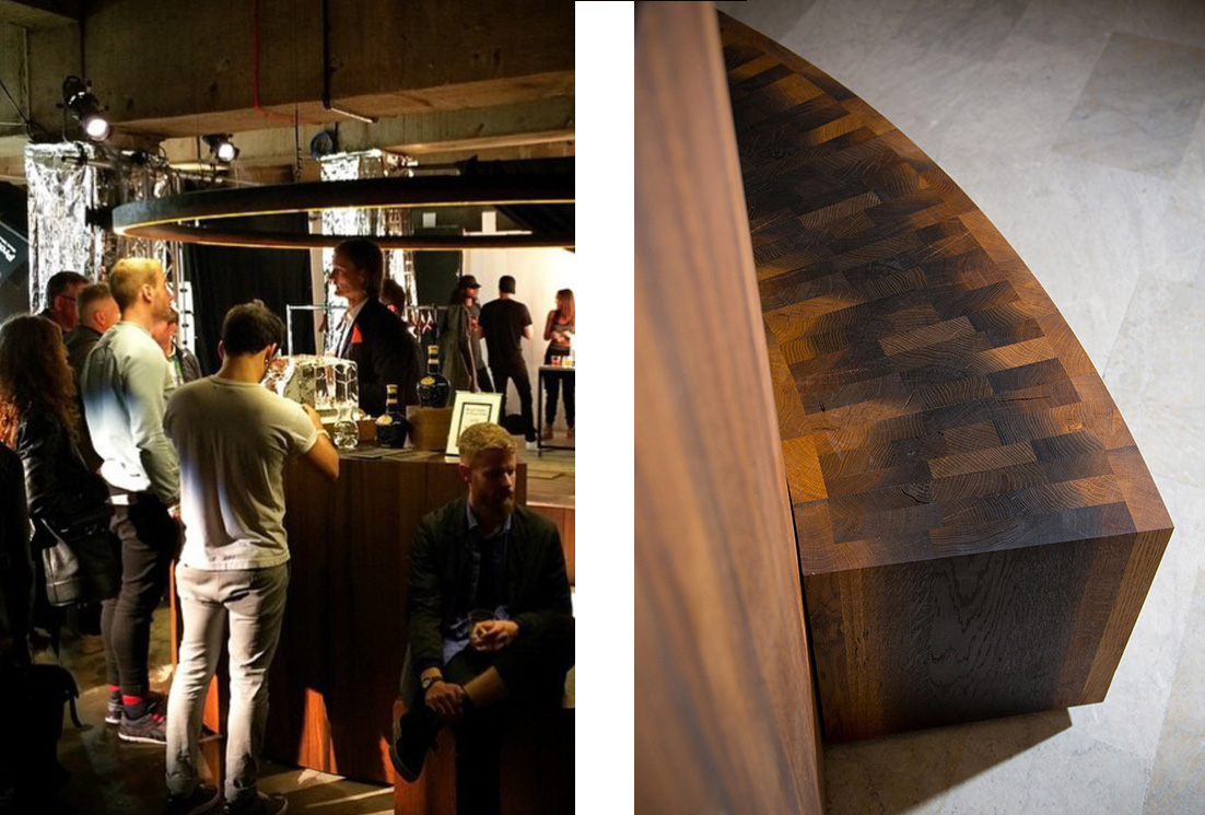 Left: The bar is christened at the launch party at Wallpaper* Handmade at Salone del Mobiles in Milan Right: Solid staves of 8000 year old oak have been tightly bonded together to form circular seating giving the ancient material a strangely pixellated surface pattern.