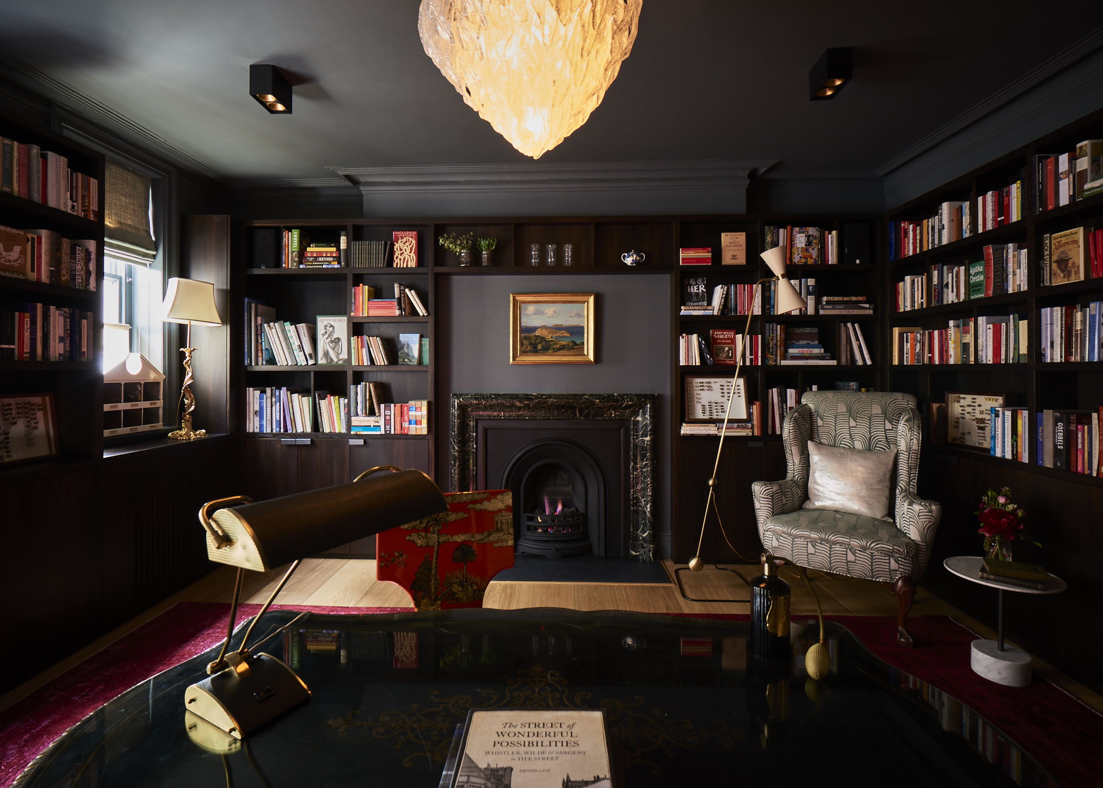 The library on the ground floor lined out with fumed oak bookshelves, offers a quiet, contemplative space.