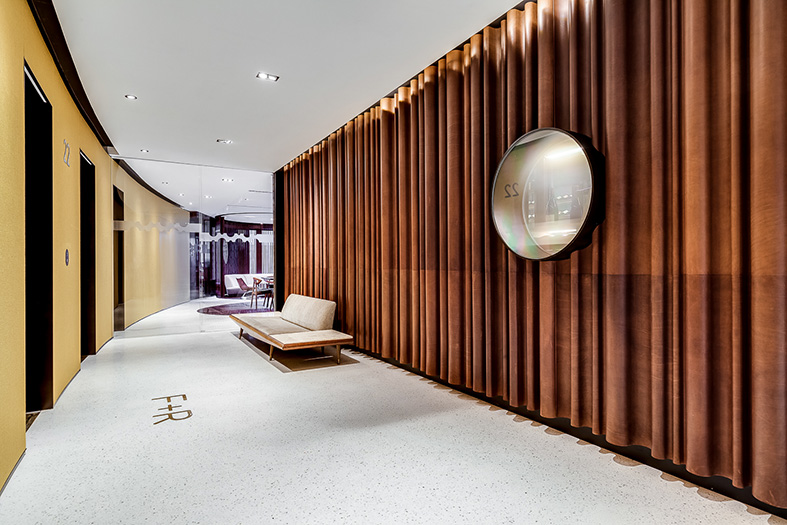 Undulating leather panels in the lobby are interrupted by a metal lined aperture switching between moments of film projection and glimpses into the cellar beyond.